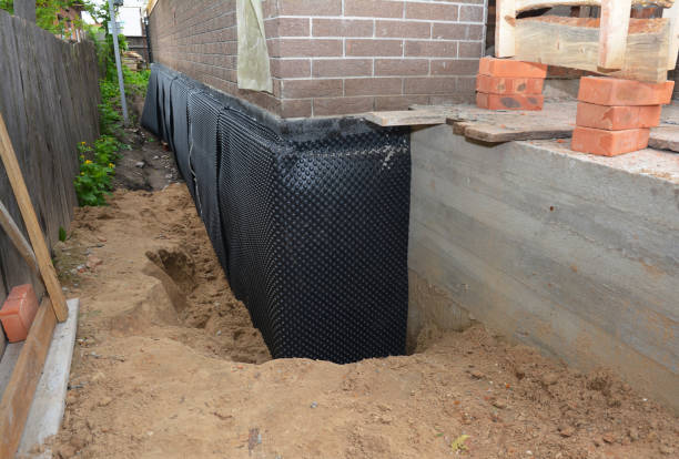 Happy homeowners after waterproofing job in Otsego